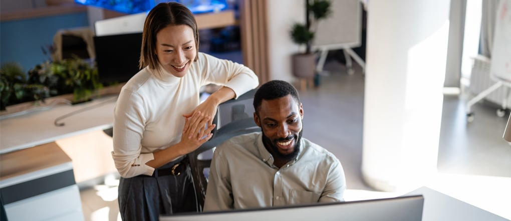 Employees at a company review an enterprise technology platform following a deployment readiness assessment.