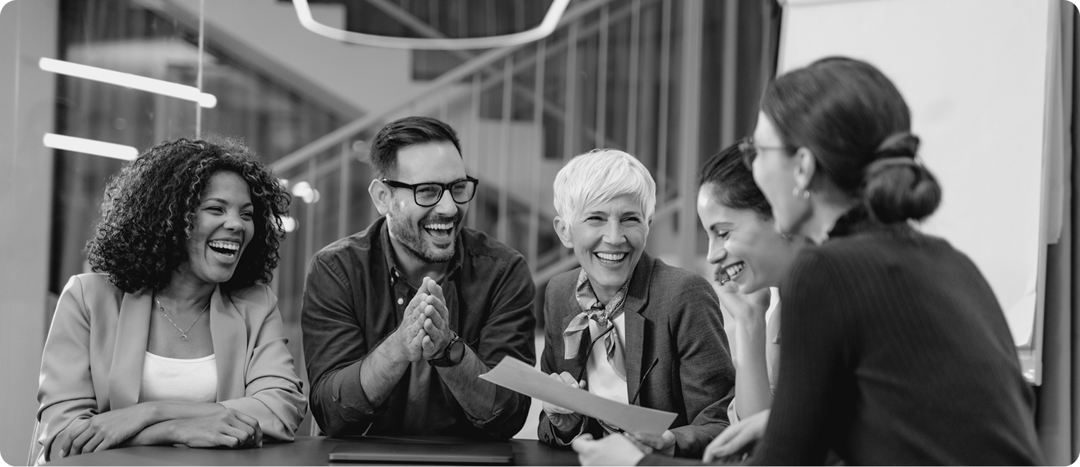 A photo showing team members celebrating a company's success and achieving business objectives, thanks in part to organizational alignment