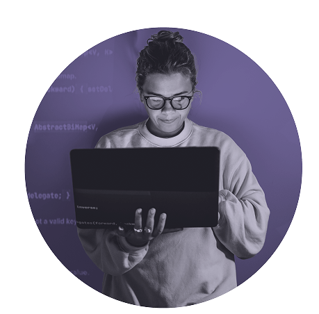 women looking down at laptop