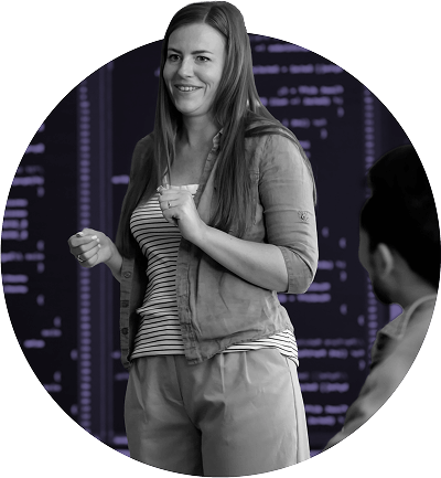 women speaking to a group of people