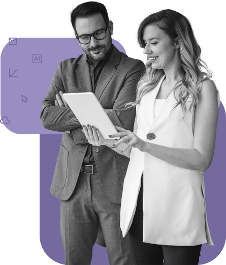 male and female looking at a tablet and smiling