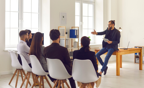 Man teaching insights to classroom of people