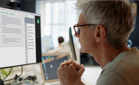 Man with glasses assessing AI readiness on computer