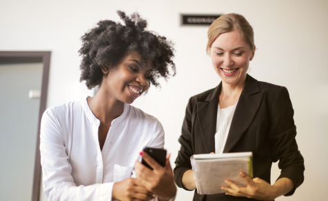 Government officials looking at data on tablet