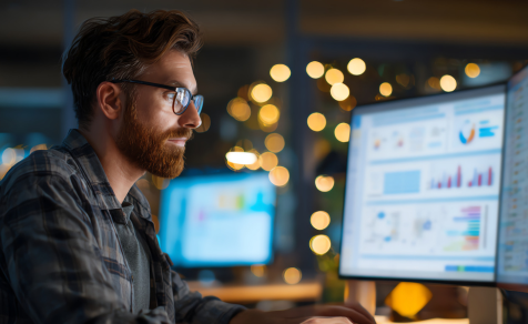 Employee working on computers for application managed services